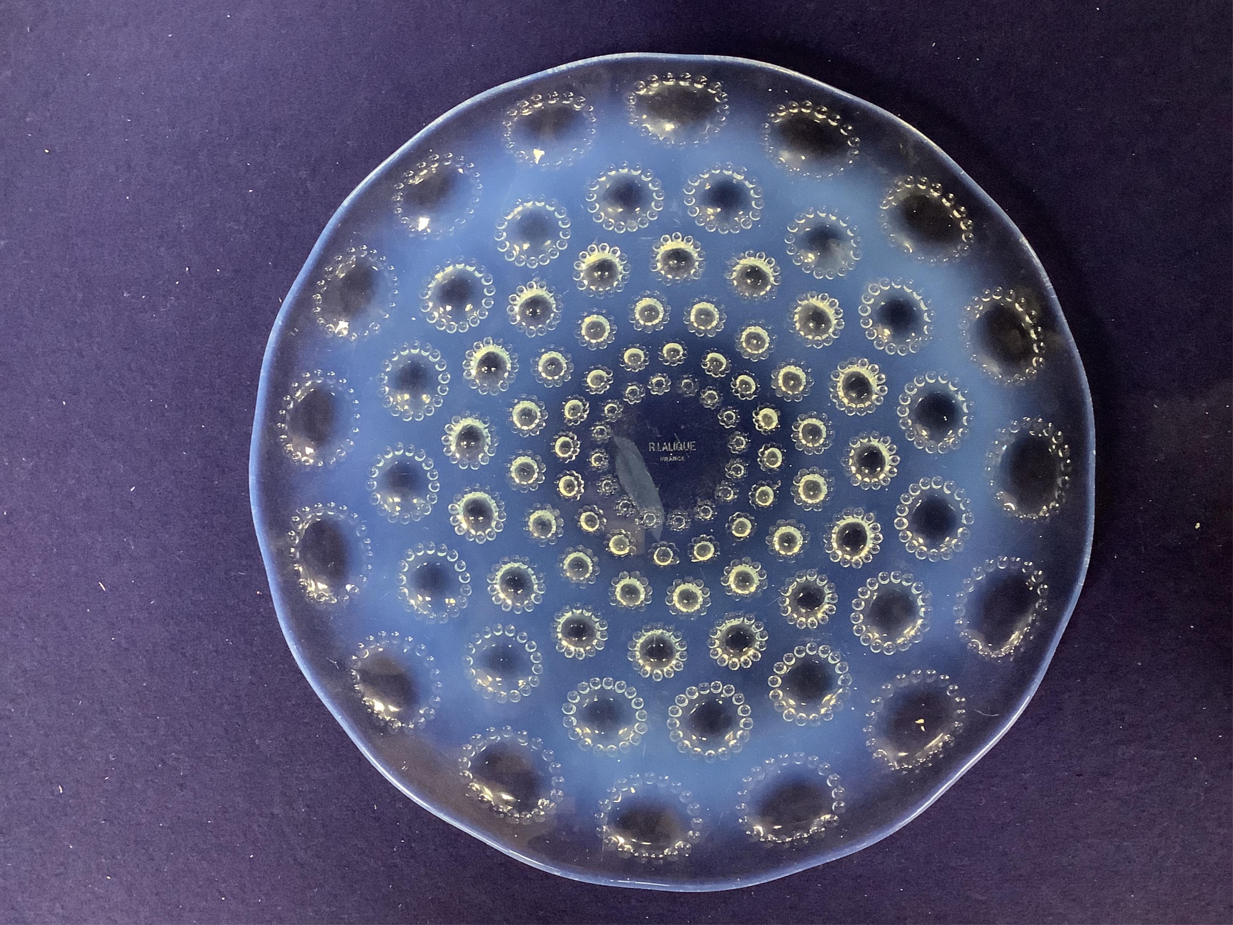 A Lalique Asters coupe-ouverte glass dish, etched R. Lalique France to the base, 28cm in diameter